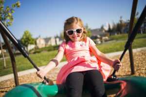 Smiling girl on swing